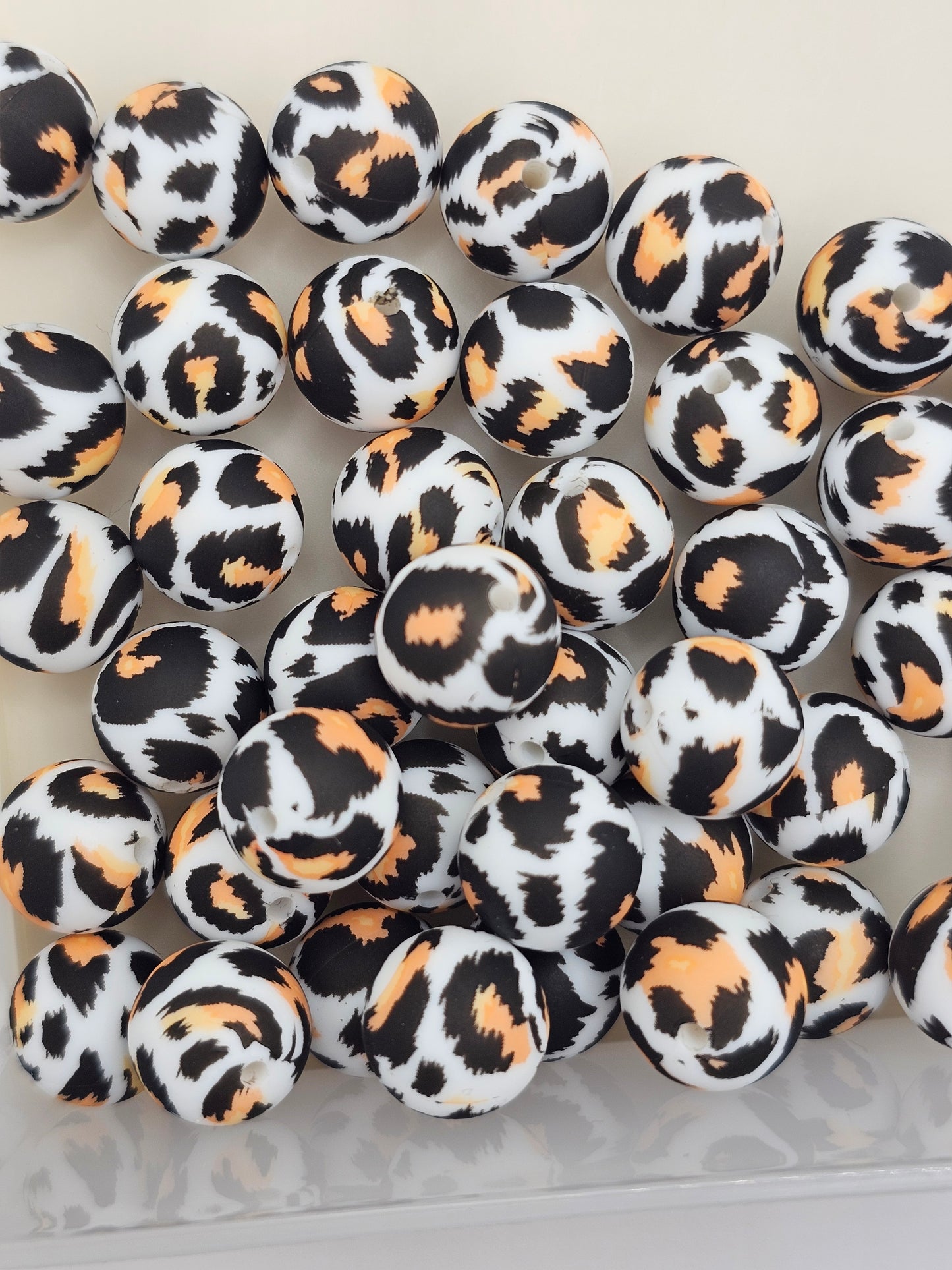 Orange and black cheetah print 15mm silicone round bead