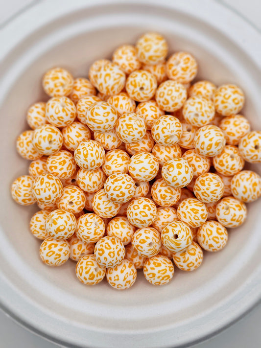Orange and white cheetah print 15mm silicone round bead